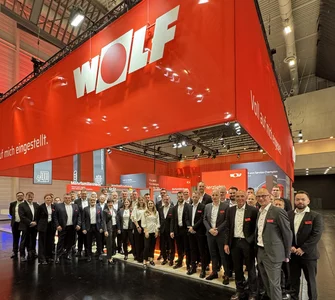 WOLF Messestand auf der IFH/Interm mit rotem Banner