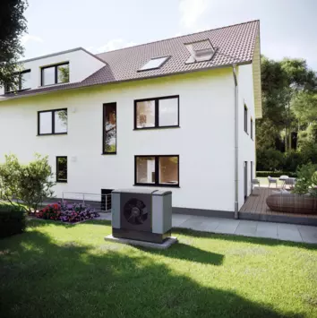 Darstellung einer Wärmepumpe die sich im Garten eines Hauses befindet 